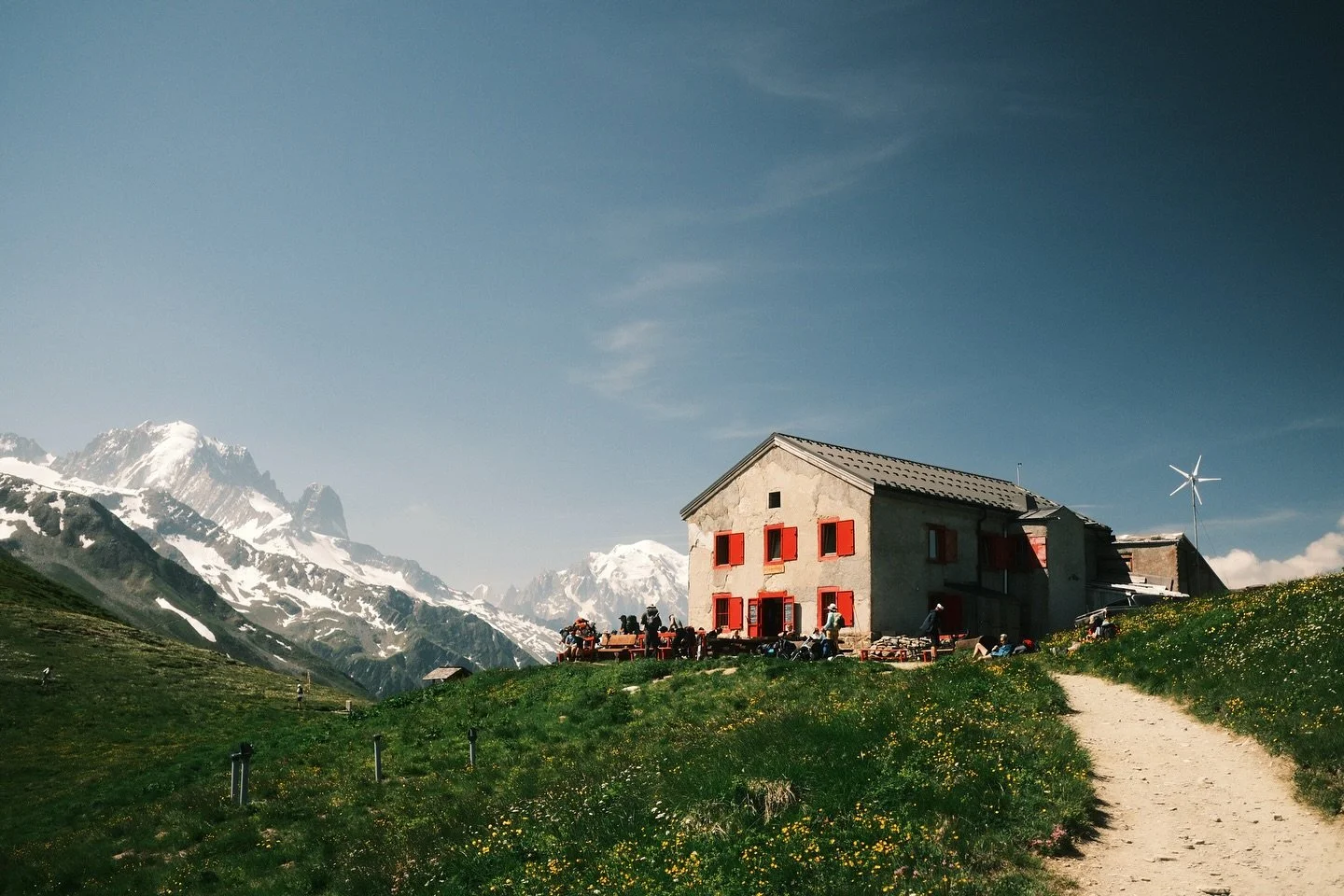 Day four of hiking the TMB over a long weekend.

Sitting proudly amongst the mountains on the border between Switzerland and France, Refuge du Col de Balme, with it&rsquo;s vivid red shutters, is a welcome sight. It marks the last high point of our t