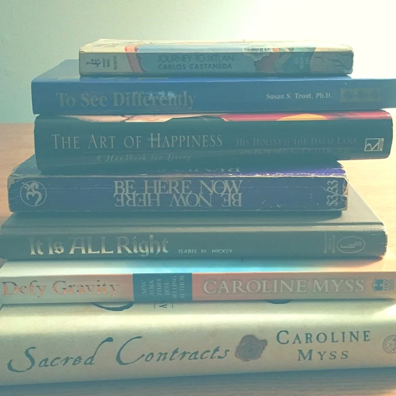 reiki and spiritual guidance books, pen to write with on paper