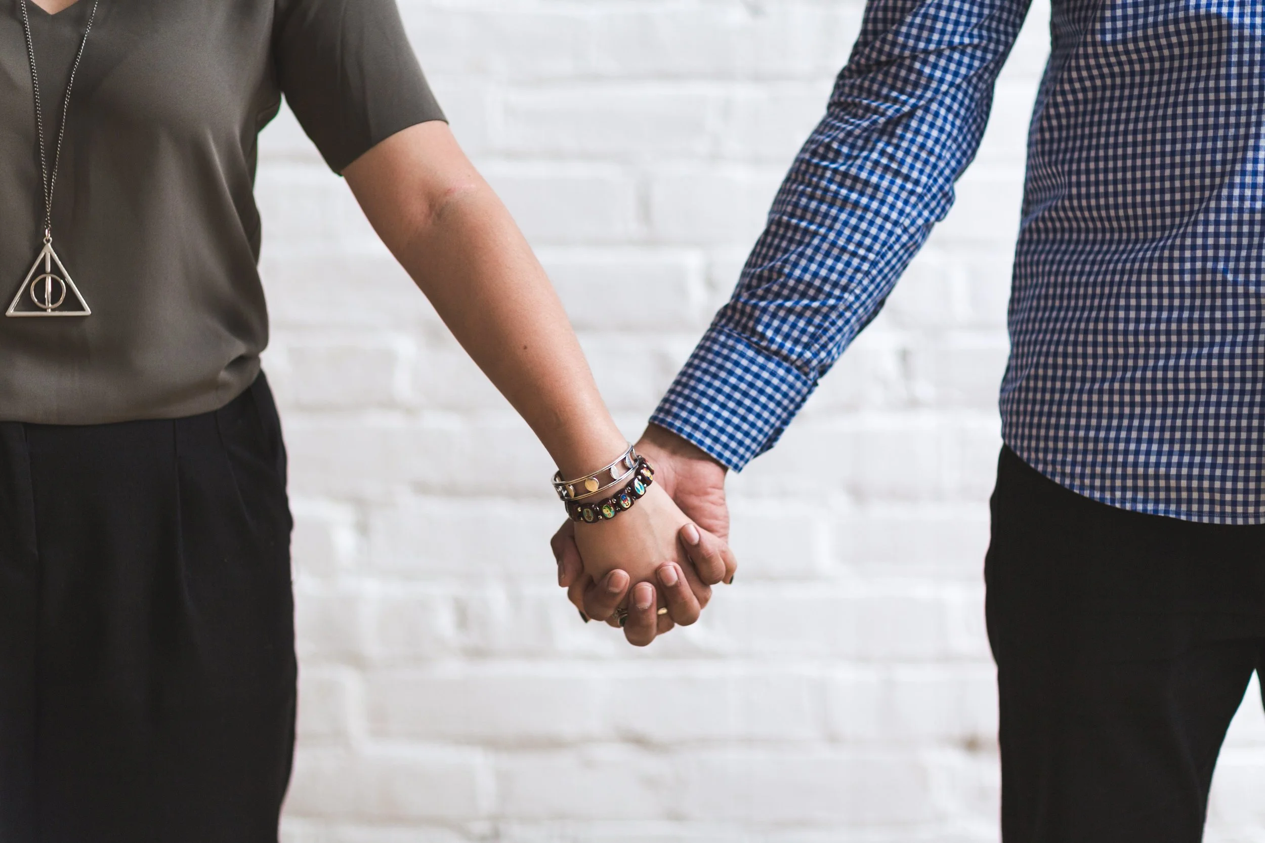 man-woman-holding-hands_4460x4460.jpg