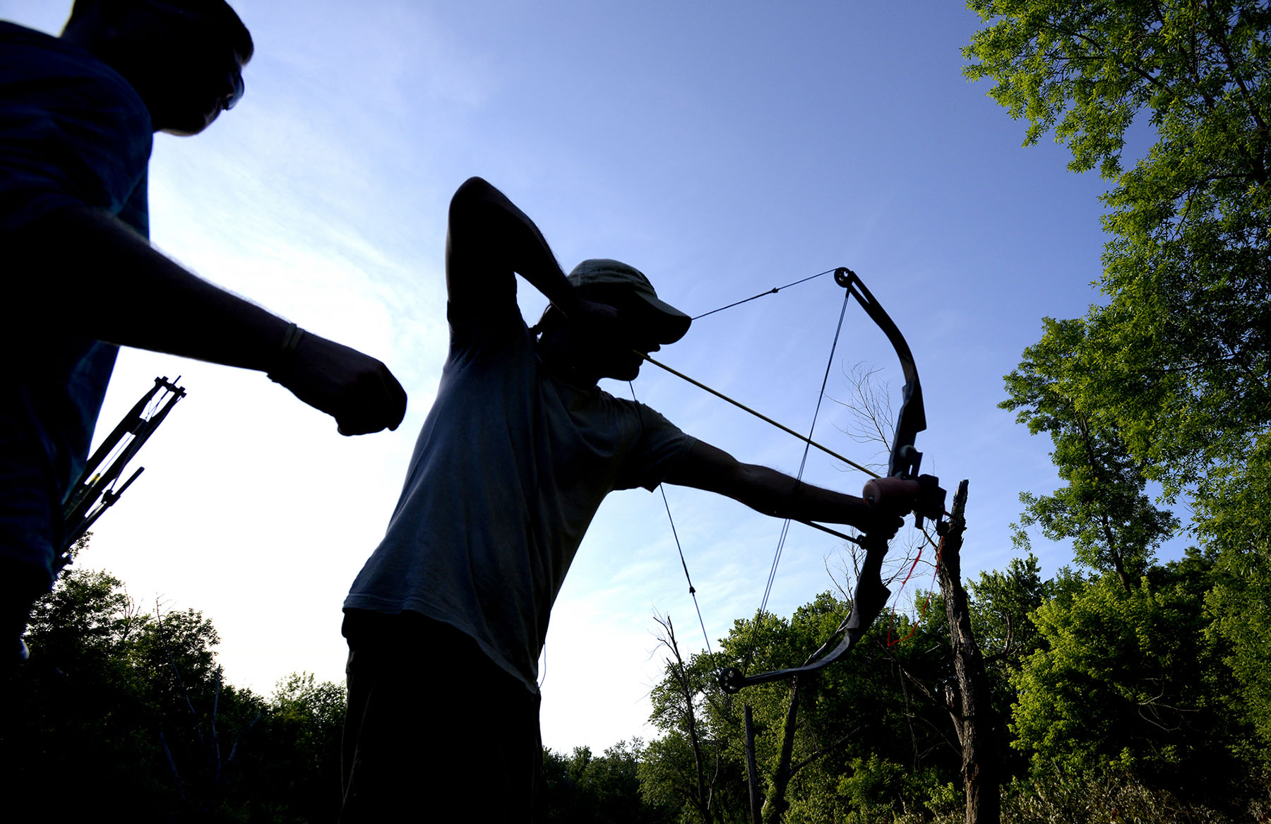  Columbia resident Guy Lanphere steers his boat while looking for carp along Moniteau Creek near Rocheport, Missouri, on June 10, 2015. Lanphere steered carefully and slowly so as not to scare any fish away. 