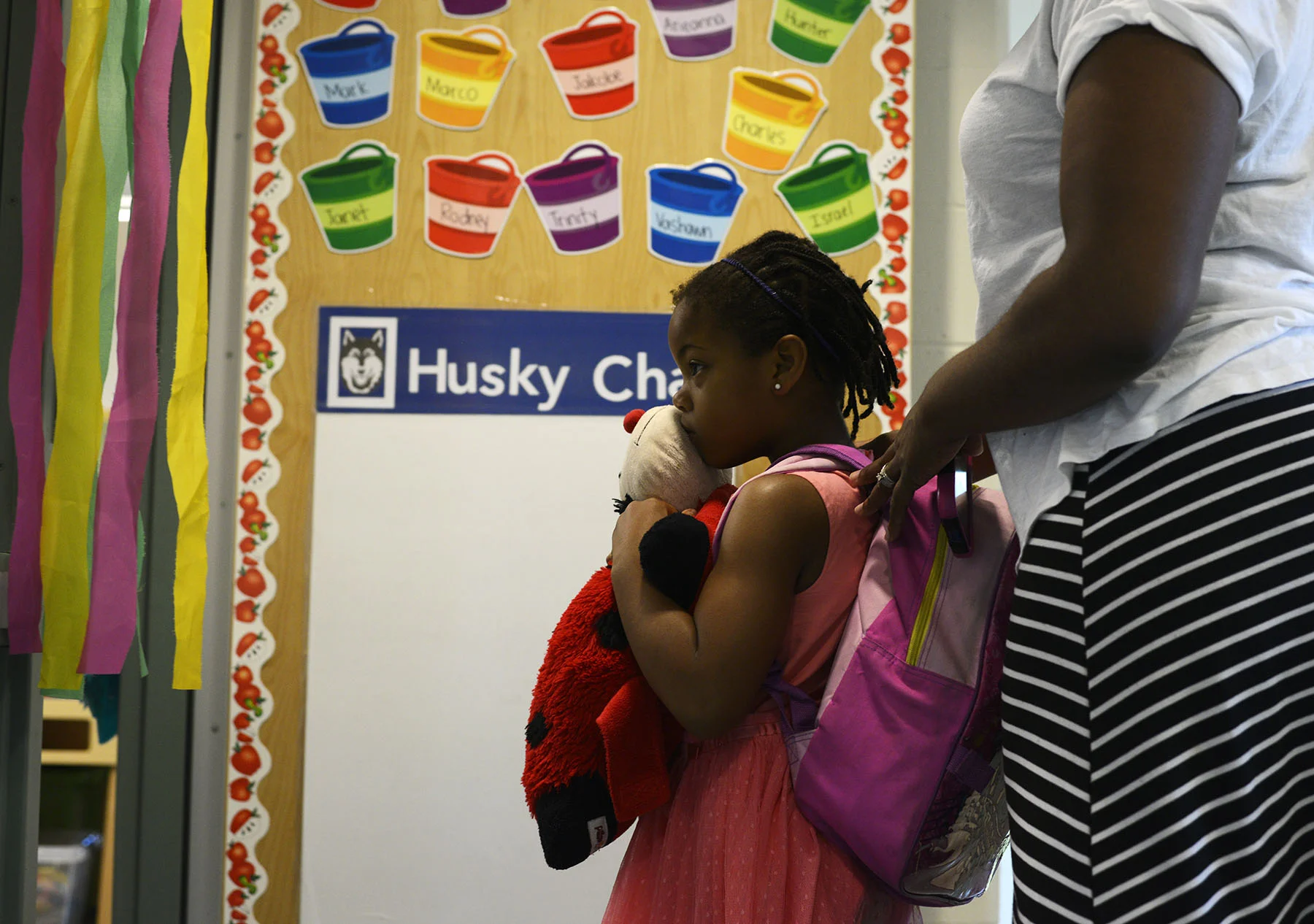  Kyndall Simmons, 5, hugs her lady bug pillow as she walks into her first day of summer school Kindergarten at Alpha Hart Lewis Elementary in Columbia, Missouri, on June 8, 2015. Simmons was initially shy at first, but was soon relieved to see one of