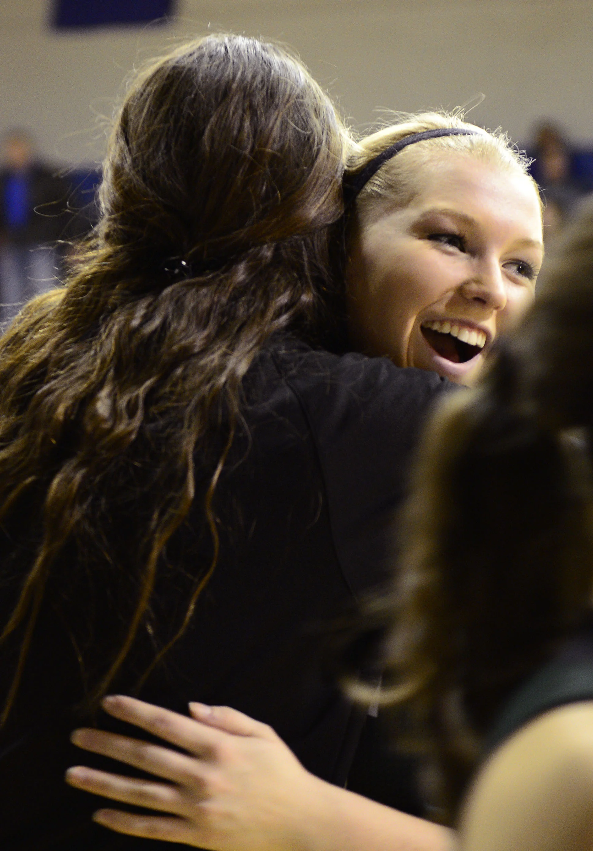  Madison Ausfahl receives a hug from teammate Taylor Wilson right after the clock runs out and making North Callaway’s win official in Center, Missouri, on Feb. 16, 2016. The team battled neck-and-neck with Mark Twain in the first half and only finis