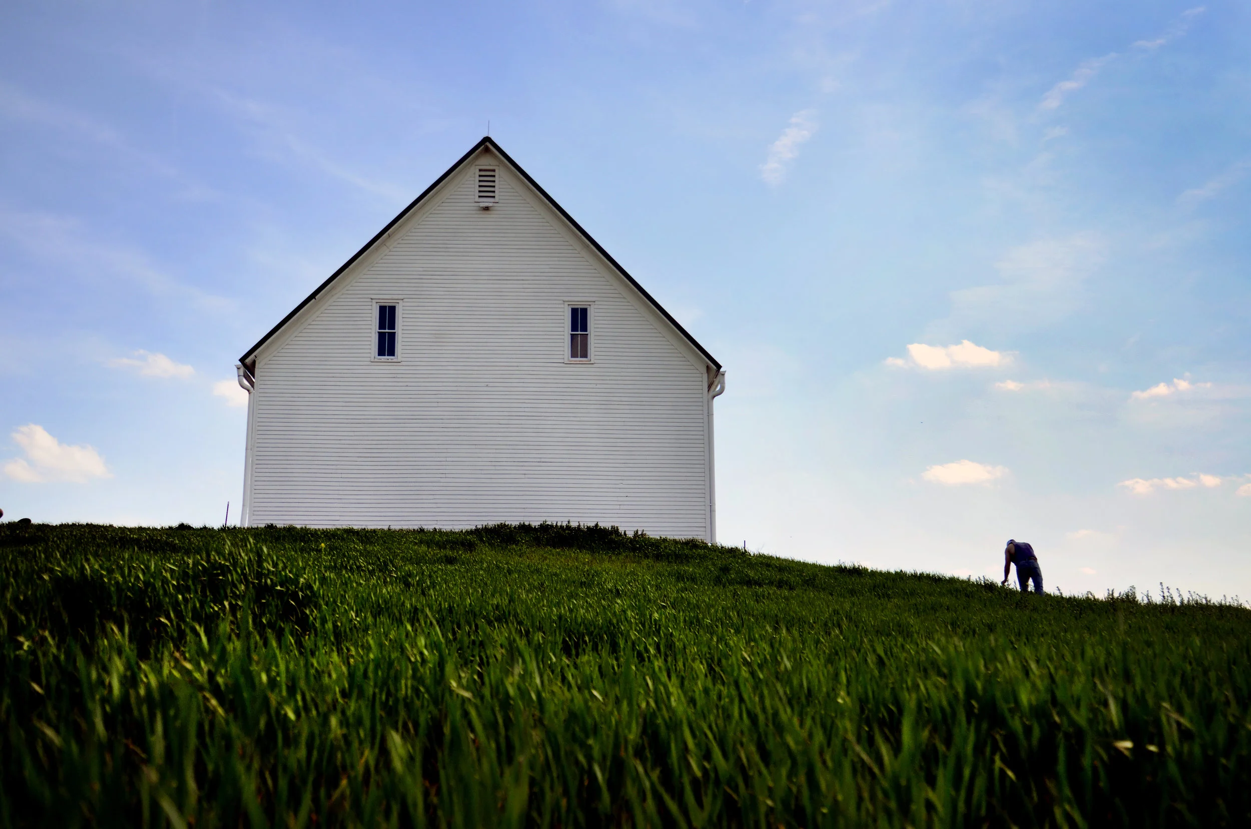  Zach Emmendorfer, 21, stands in a wheat field next to a barn on his family’s farm in De Kalb, Missouri, on Monday, April 18, 2016. Zach’s great grandfather built the barn in 1912 using wood from the farm. 