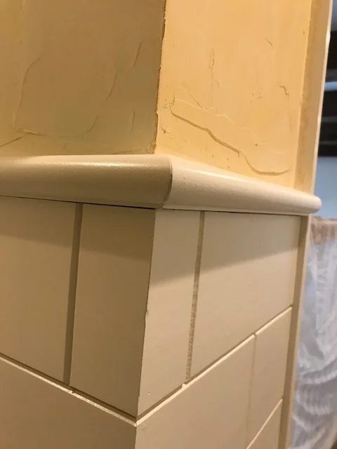 Closeup of Wainscot Cap & Skip Troweled Walls