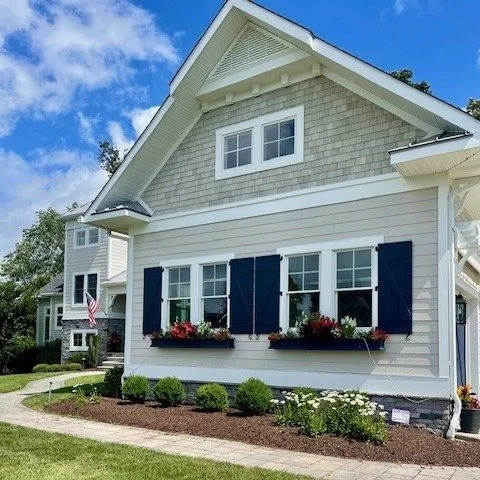 Product Spotlight - NuCedar Shake Siding.  Everyone loves the look of real cedar shake siding but not everyone appreciates the look as it weathers over time.  We replaced the 10 year old real white cedar accent shake siding with NuCedar Roughsawn Sha