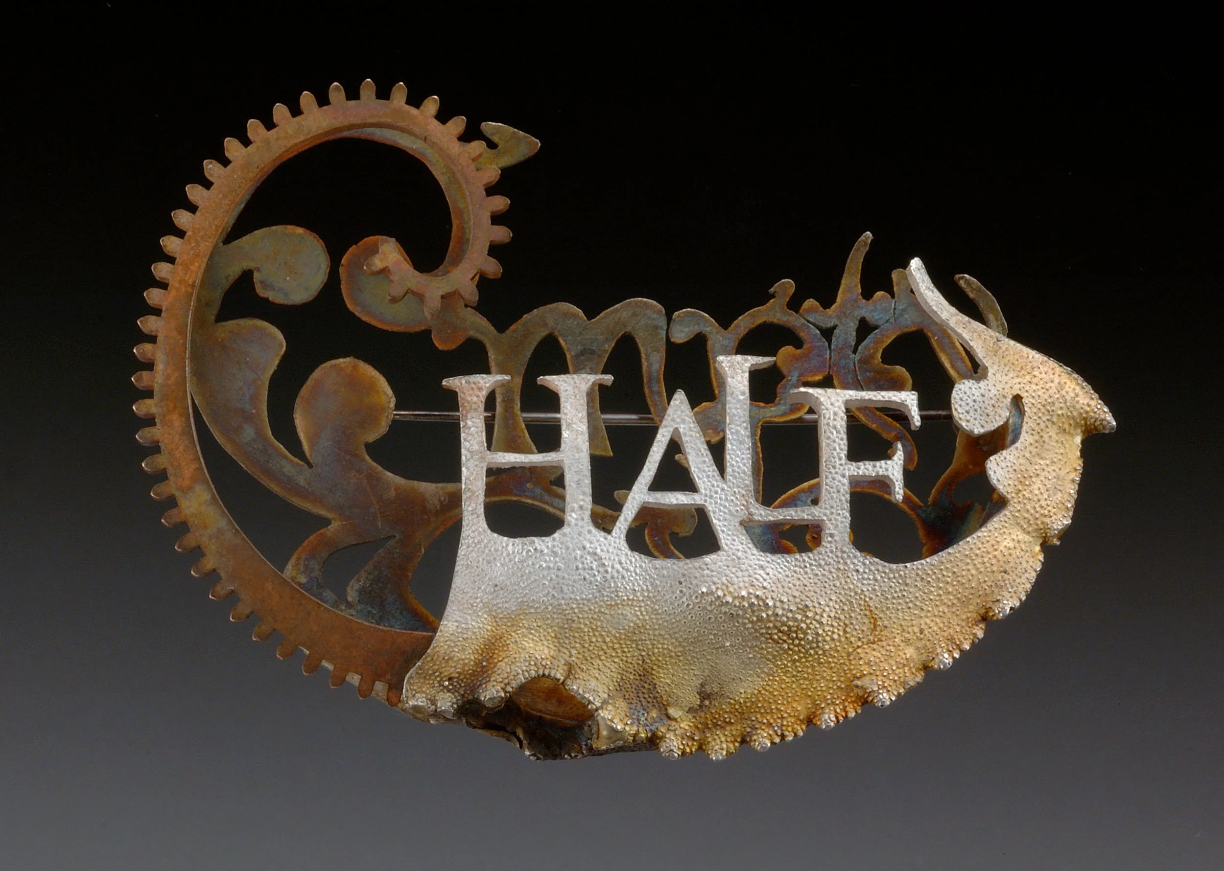   Title:  "Half"  Brooch- Silver, bronze.  3" x 2" 