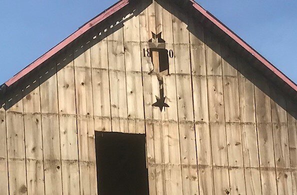 Stars and 1880 date on east gable.