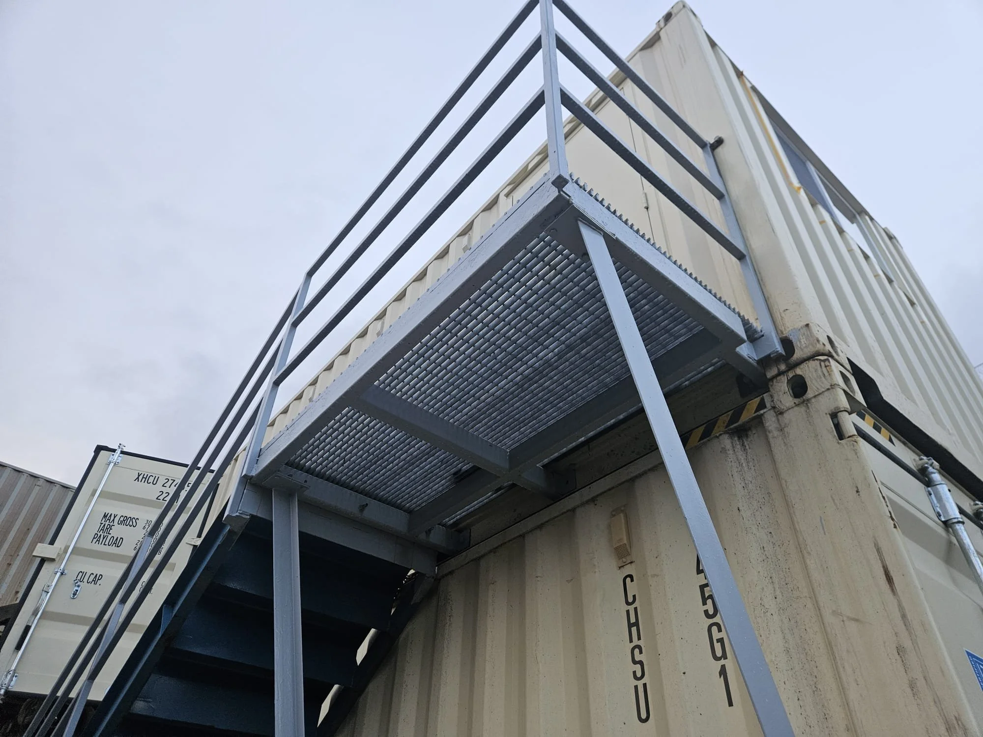 Shipping containers modified for a rodeo business's operational needs