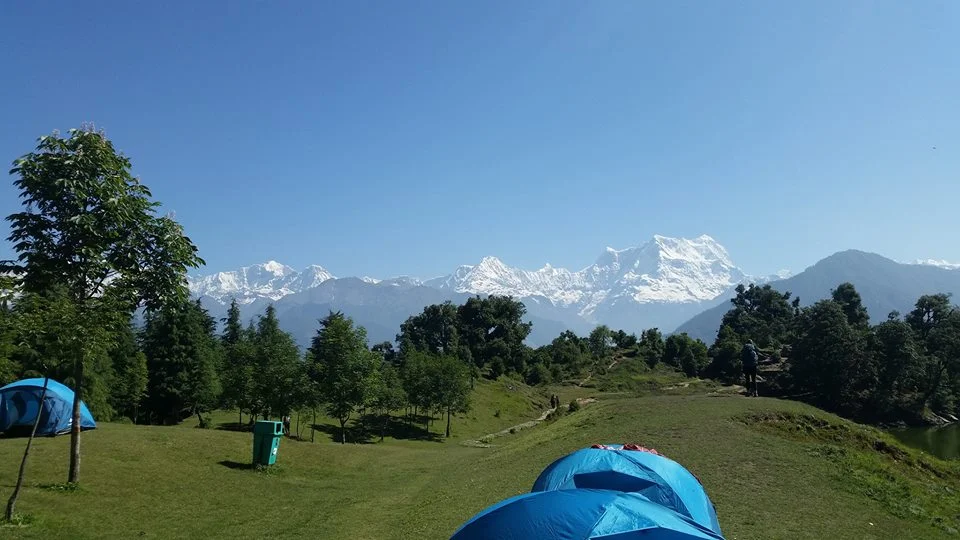 Campsite on night 1 of our 3-day trek in the Himalayas - snow-capped mountains in the background.