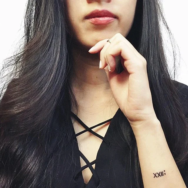 Celebrated turning 22 on 2/22 by getting a 22 tattoo at 2:22 while listening to Taylor Swift's &quot;22&quot;.