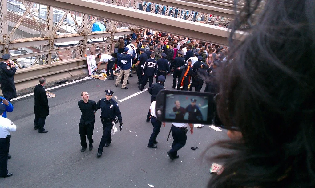 Many newsrooms use citizen journalism to cultivate relationships that can end up as something more like appropriation. This started its peak around the Arab Spring and the US-based Occupy Wall Street protests, as shown here. Some rights reserved by Nick Gulotta .