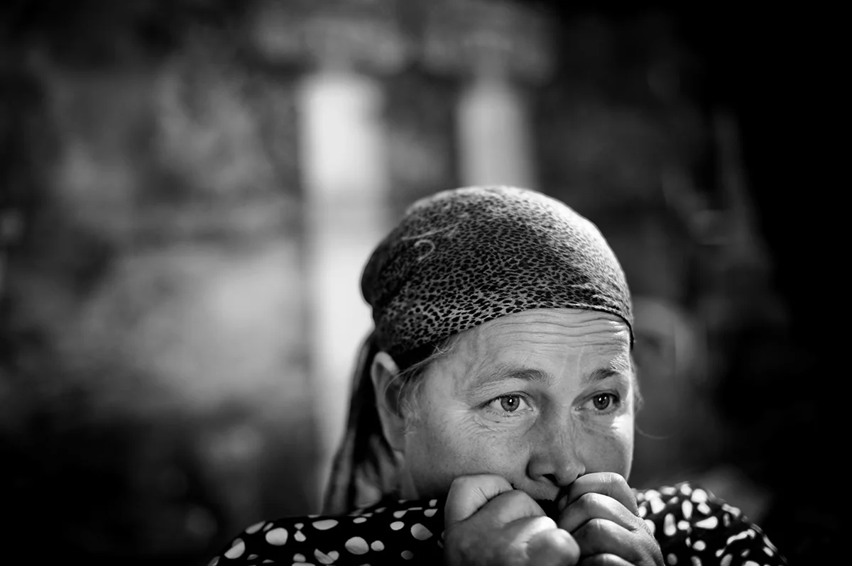 Russia, Ingushetia, October 2009, A Chechen refugee is frightened during a Russian police visit to the refugee camp where she lives.