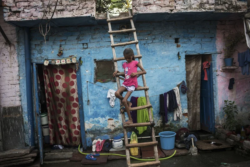 India, New Delhi, 02 October 2016, Baby, 10, sits outside her home in a New Delhi slum. Her family says she has suffers from constant diarrhea.