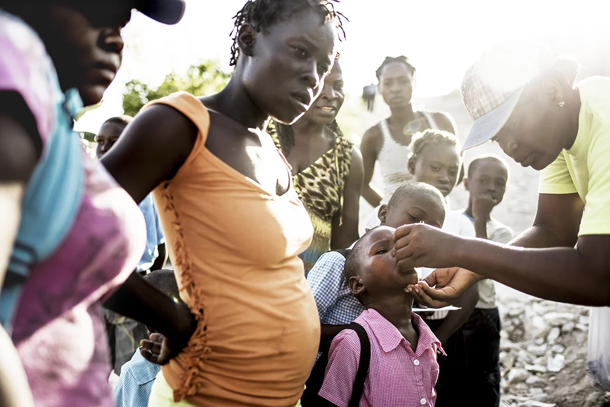 Haiti, Les Cayes, 14 November 2016, People living in a displacement camp called "Abri Lafwa" or "Faith Shelter" outside Les Cayes, Haiti, receive a cholera vaccine provided by the Haitian government.
