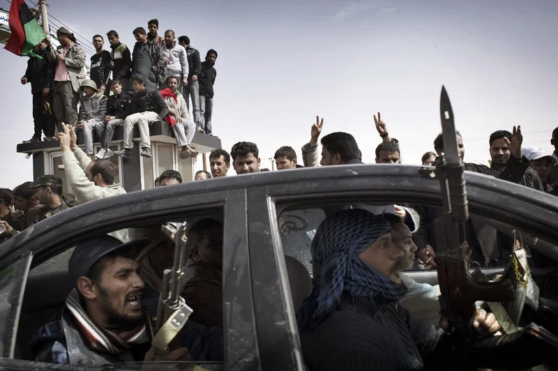 AJDABIYA, LIBYA - MARCH 02: Rebel fighters advance towards the front line against Libyan government forces