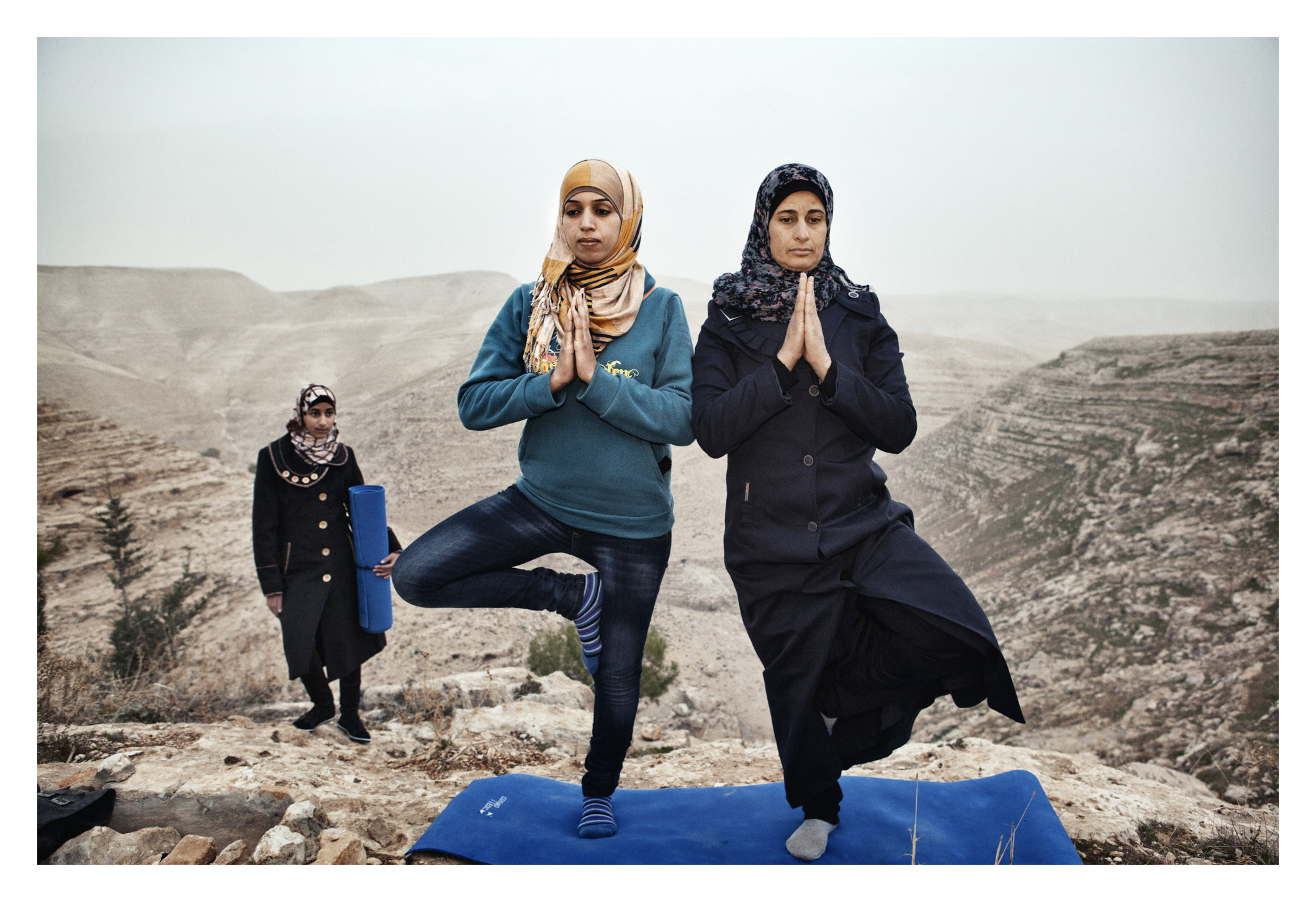  Occupied Palestinian Territories, West Bank, Za'tara, 06 January 2013

Hayat (left) teaches yoga to the residents of her village, Zataara,  on the outskirts of Bethlehem in the West Bank. The women are increasing in number each week. 