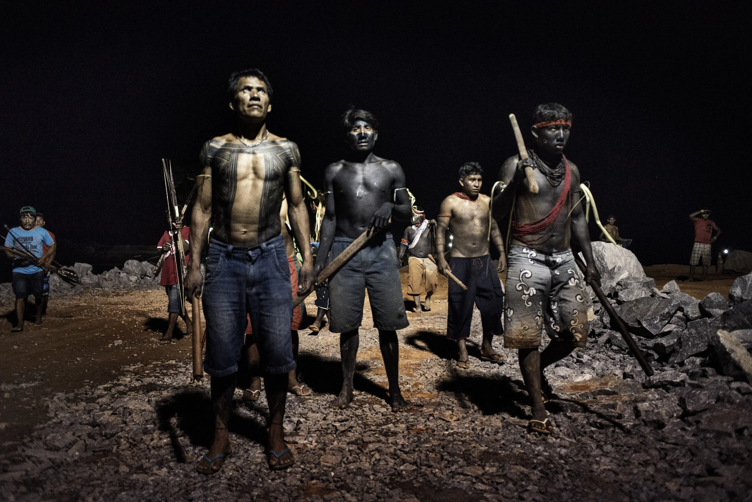 Belo Monte construction site, Altamira Brazil October 09 2012
On Tuesday 9 October, around 80 ?warriors? in full war paint and armed with bows and arrows, clubs and lances occupied a construction site for the Belo Monte hydroelectric plant on the Xingu River, a tributary of the Amazon in Brazil.
In a cloak-and-dagger operation, the native Indians stormed the Pimental cofferdam, chased off around 900 construction workers and took control of a large number of trucks and Caterpillar construction vehicles.