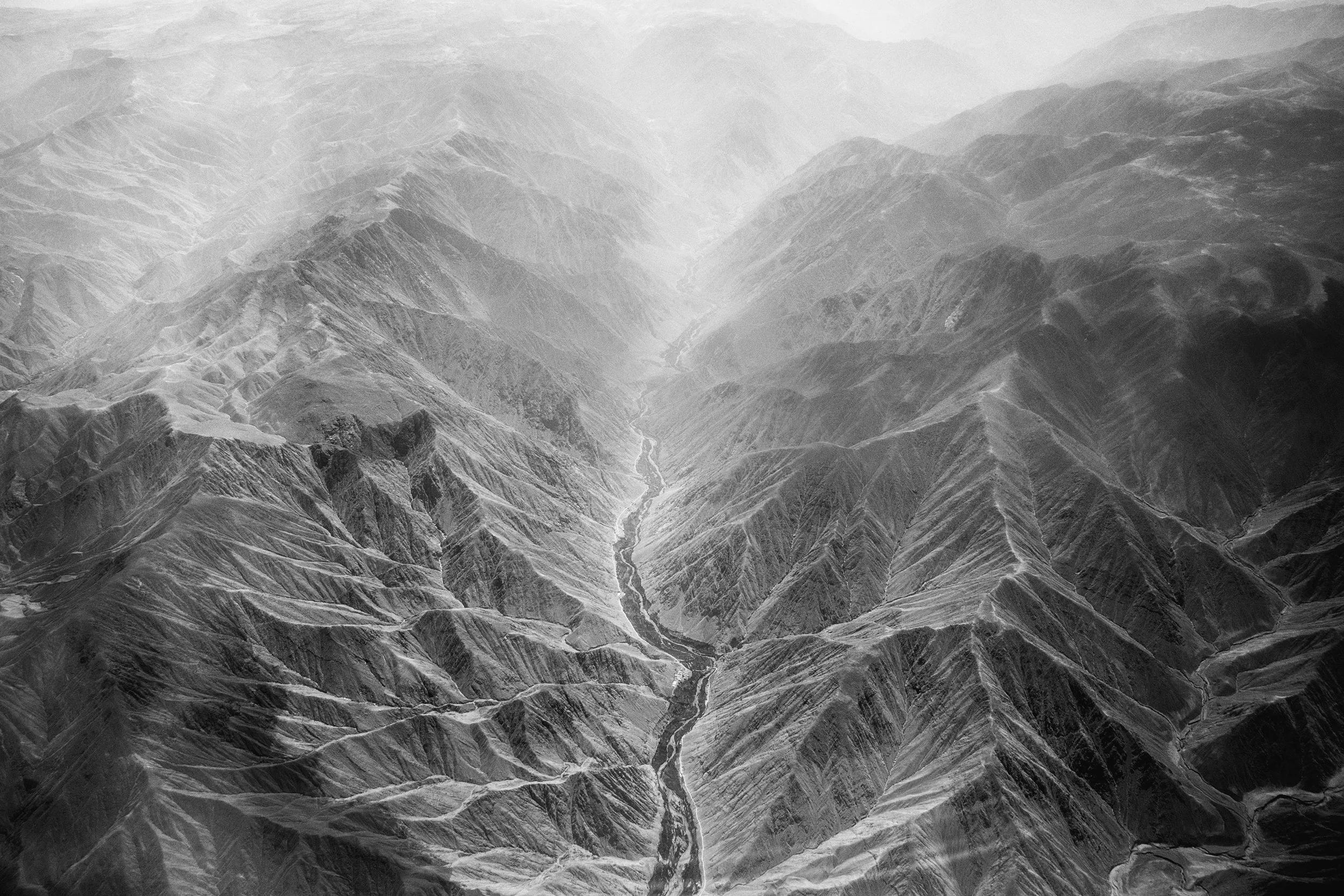 Peru, Andes, 20 August 2016
Aerial view of the Andes from the flight Lima-Cusco.
The Andes are the longest continental mountain range in the world. They are a continual range of highlands along the western edge of South America. This range is about 7,000 km (4,300 mi) long, about 200 to 700 km (120 to 430 mi) wide (widest between 18� south and 20� south latitude), and of an average height of about 4,000 m (13,000 ft). The Andes extend from north to south through seven South American countries: Venezuela, Colombia, Ecuador, Peru, Bolivia, Chile, and Argentina.
Sebastian Liste / NOOR