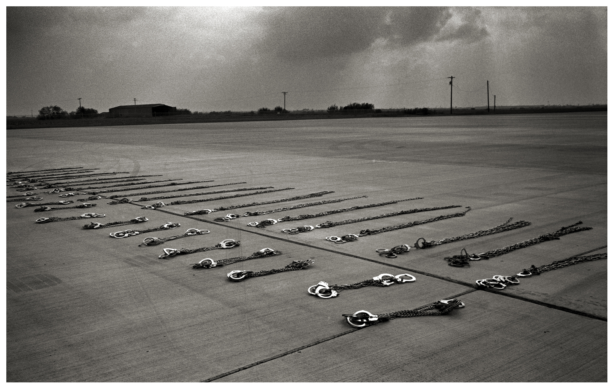  Handcuffs lie on the ground before being put away after shackling a group of undocumented immigrants who were being transported from Pennsylvania to the border crossing at Hidalgo. All the men had spent time in county jail in Pennsylvania and were s