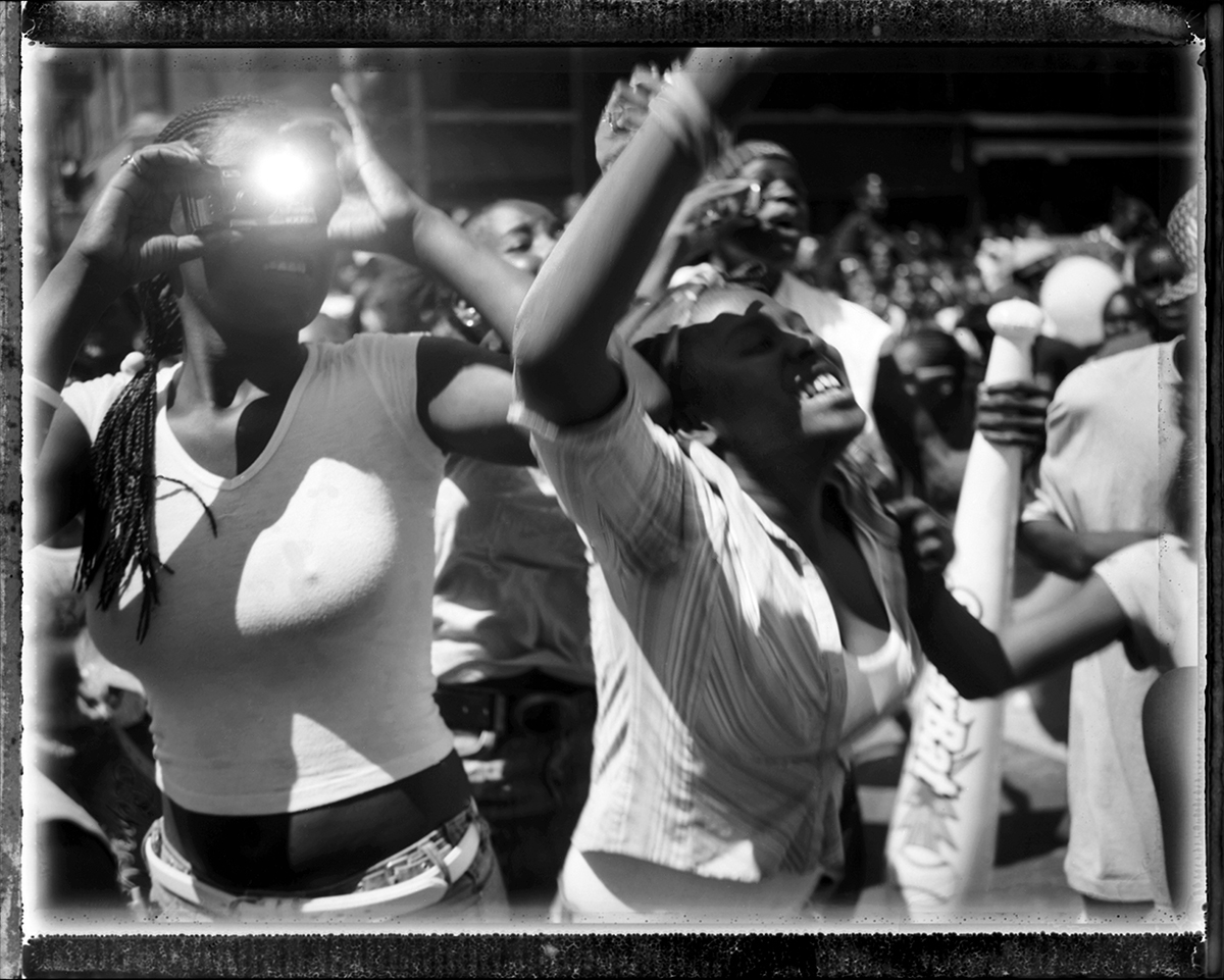   USA, Chicago, May 2005, Fans of Yung Jock scream and tossle for attention for the well known rapper as he rode by on the WGCI Radio Station's float in the annual Bud Billiken Parade in 2006.  