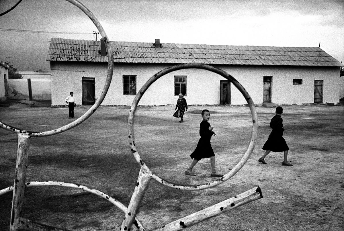 Uzbekistan, Khodjely City, 1997, Uzbek children plays in the court of the Republican Recover School.