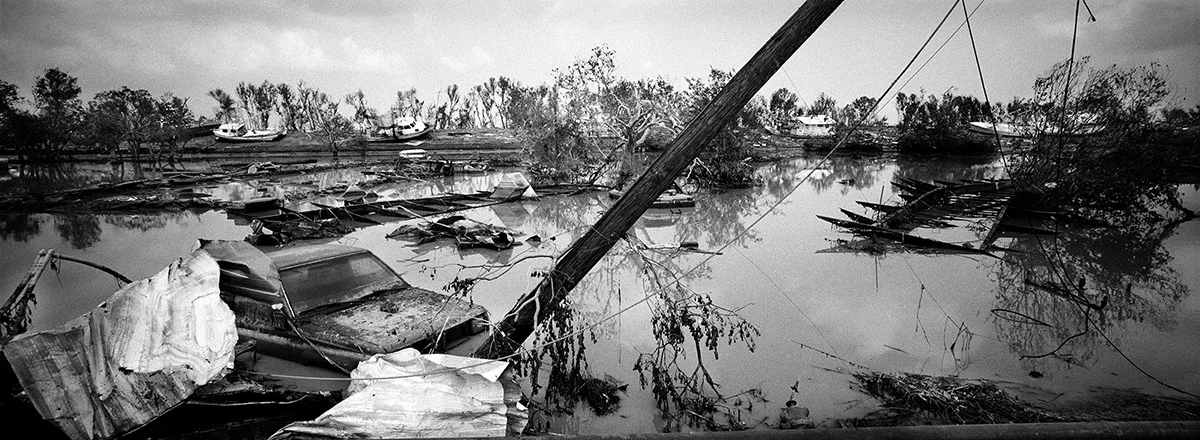 USA, New Orleans, September 2005, Lake Shore Drive, outskirts of New Orleans, as the flood waters receded, cars and boats still were submerged in several feet of fetid water.