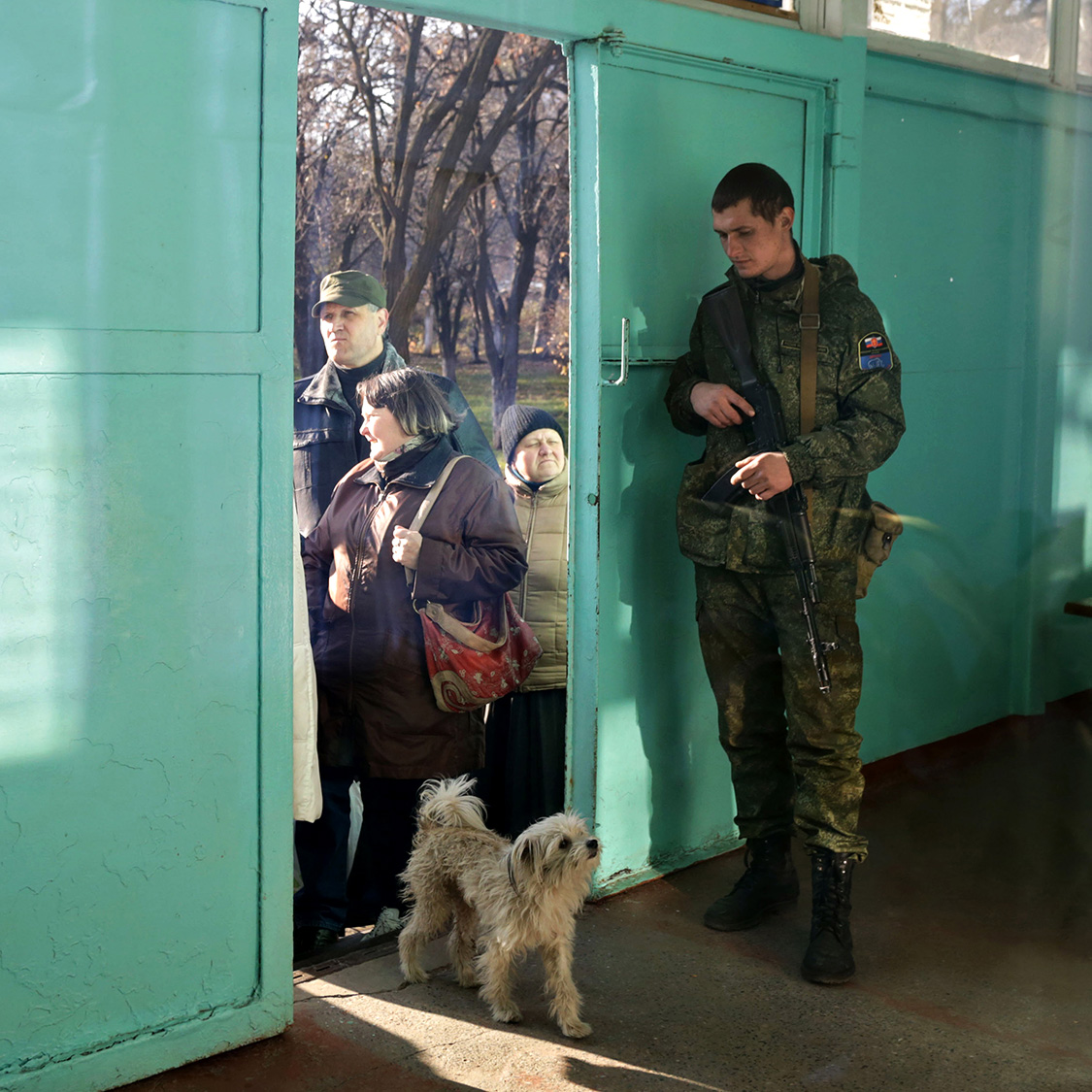  A Russian-backed insurgent guards the polling station on the election day in Donetsk, Ukraine.  