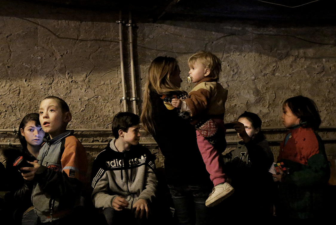  Children and their parents stay in a bomb shelter in the Palace of Culture of Petrovskiy district in Donetsk, Ukraine.  