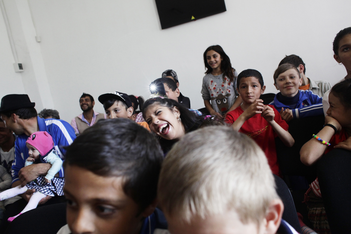  Youth in a poor Roma community laugh during a performance of theater forum play Cristina’s story, directed by Mihaela Drăgan, in Cucova, on April 17th 2016. The play talks about violence against women, discrimination and the challenges of migration.