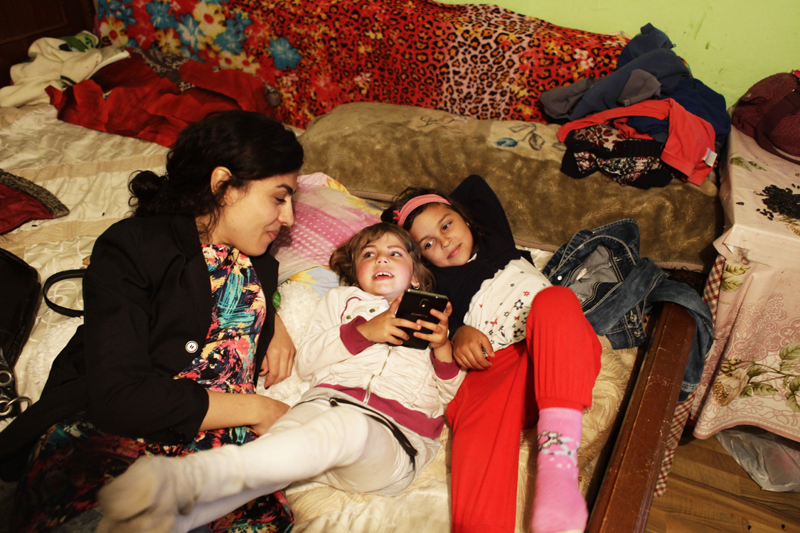  Mihaela Drăgan is talking to Roma girls in the house of a woman, after a theater performance, in a poor community in Valea Seaca, in the East of Romania, on April 16th 2016. 