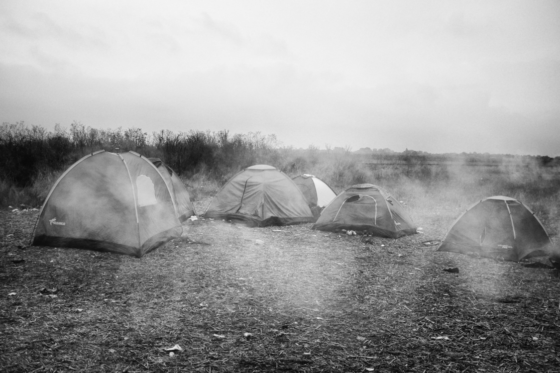  Migrants' tents forming transient campsite on an empty field in southern Hungary. 