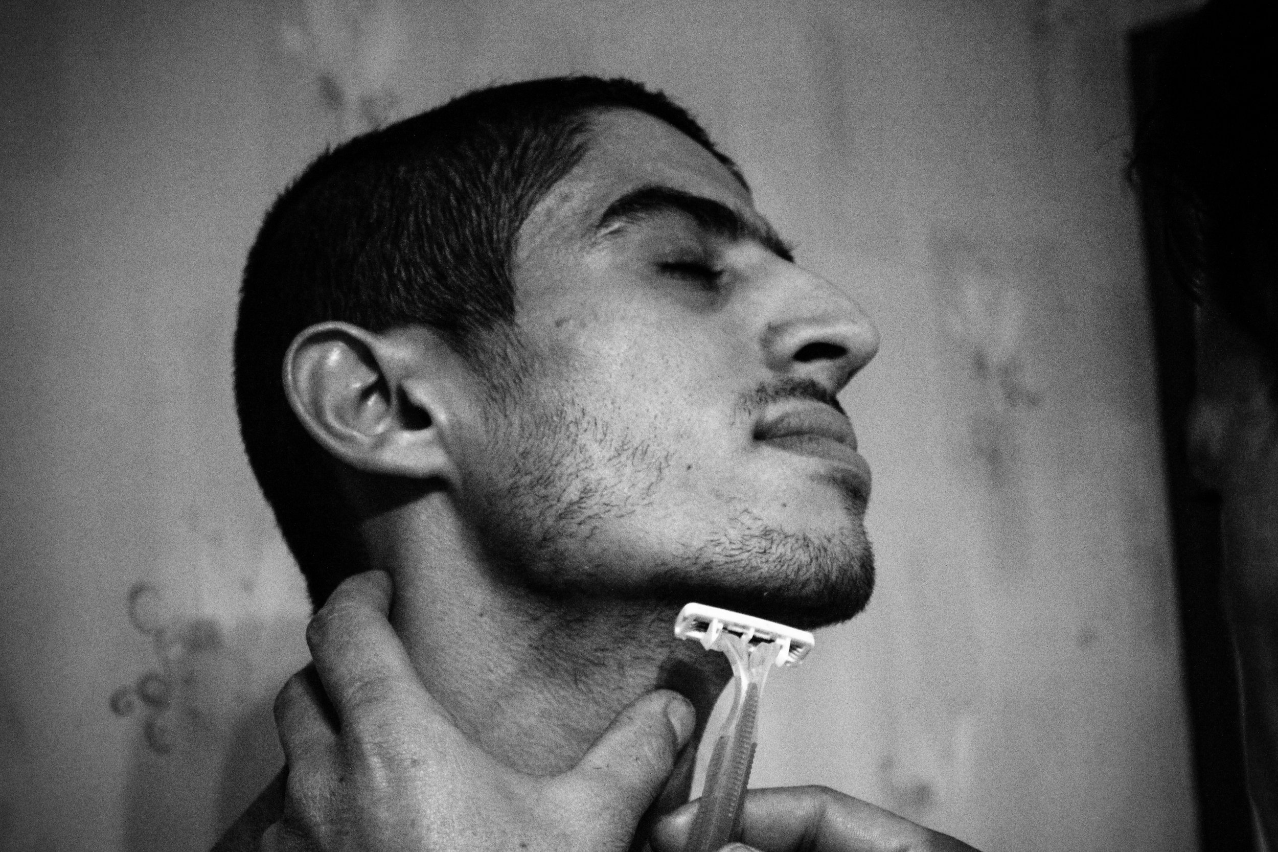  France, Marseille, 08 December 2012

A young groom is being shaved by his uncle before "El Khouara" engagement celebration. Traditionally, the man goes visiting the girl's parents to ask her in marriage. It's the moment of "Khotba". Once families fi