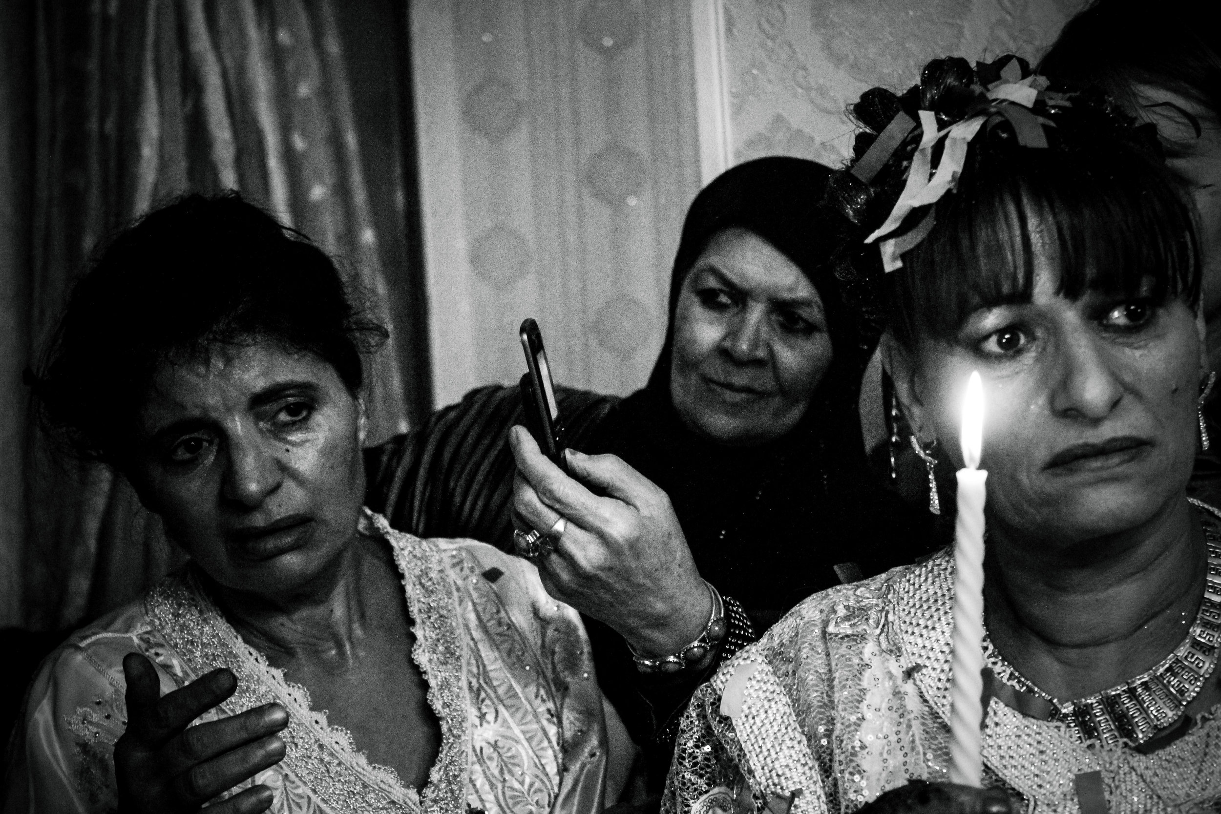  France, Marseille, 08 December 2012

Bride's mother surrounded by relatives. Her 19-years-old daughter will leave the family house less than a year after. This moment is emotional, both sad and joyful because it marks the end of childhood.

Claudia 