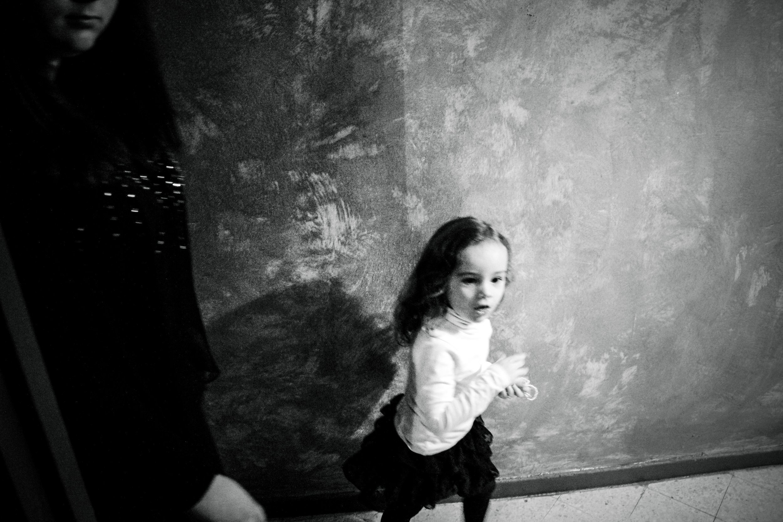  France, Marseille, 08 December 2012

A little girl runs to see the bride's "Tasdira" with new dresses. The bride will wear several looks during the party: the higher the social level of the family, the more the dresses the bride will have to wear.

