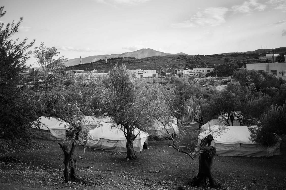  A view of the tents overlooking the lush hills and amidst the ancient olive trees of Lesbos island, Greece. 