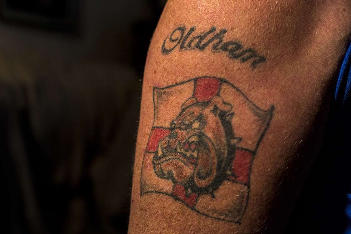  Keith Head, an Oldham local, shows his tattoos. People from all cultural groups in Oldham share the identity of their post-industrial town despite what they see their ethnic status as. 