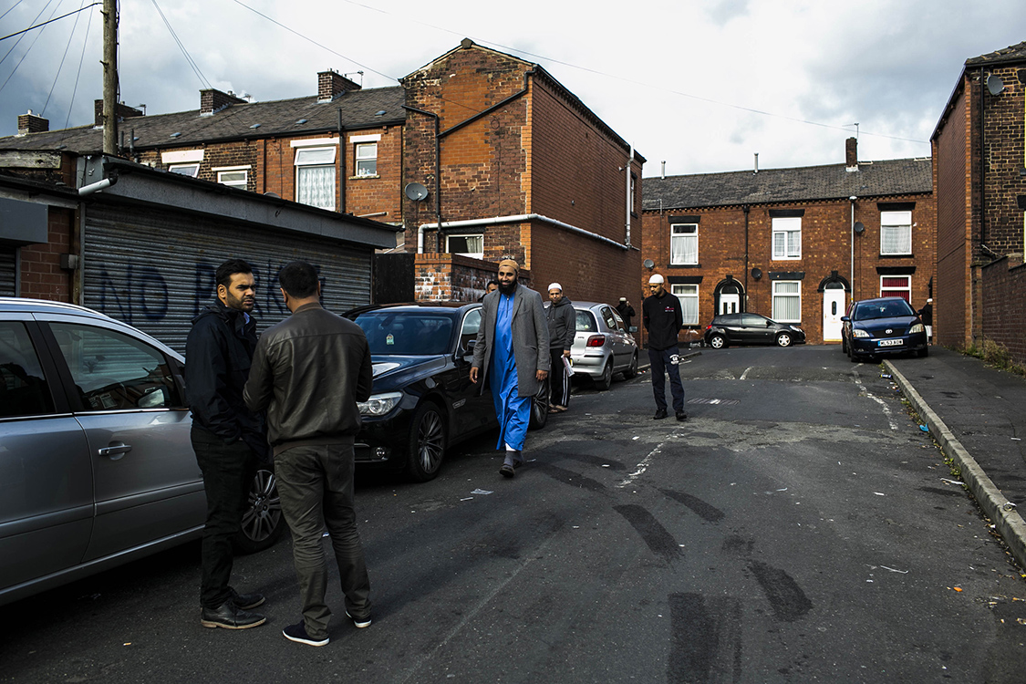  Local British Asian men before Friday prayers in the Westwood area of Oldham, a predominately Asian area.  