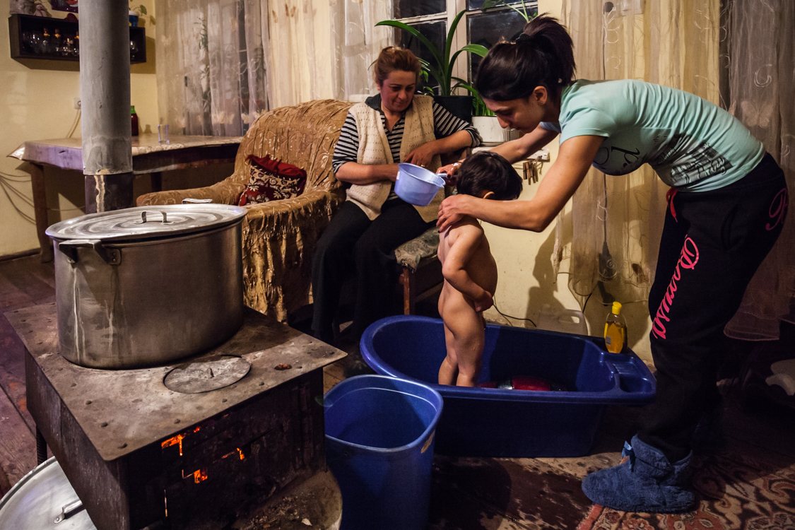  Armenia, Nerqin Karmiraghbyur, 7 February 2015

Mother gives an evening bath to her child. Especially in the evenings people avoid going out from the house. Bathrooms are usually located outside. 

Yulia Grigoryants 