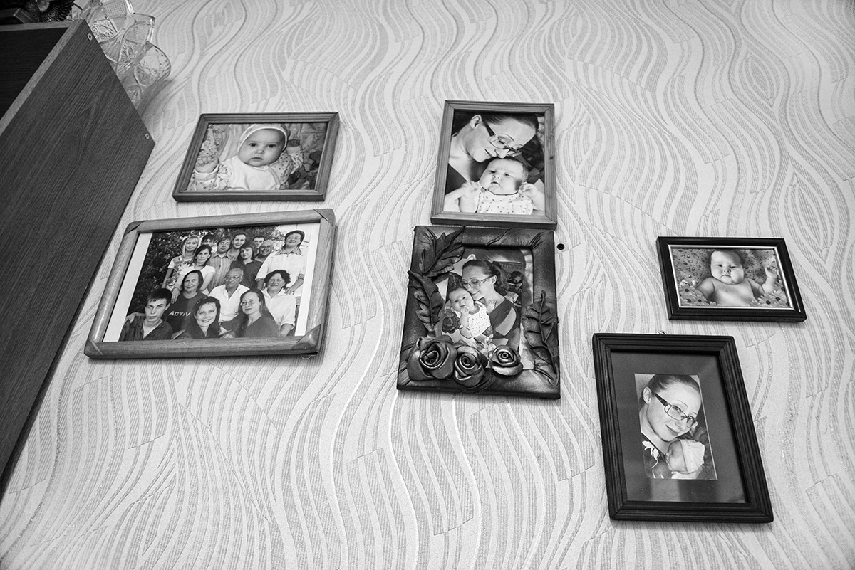  photo from the project "Lullabies for Alyona" Karaganda 2017
in the house, wall with family photos 