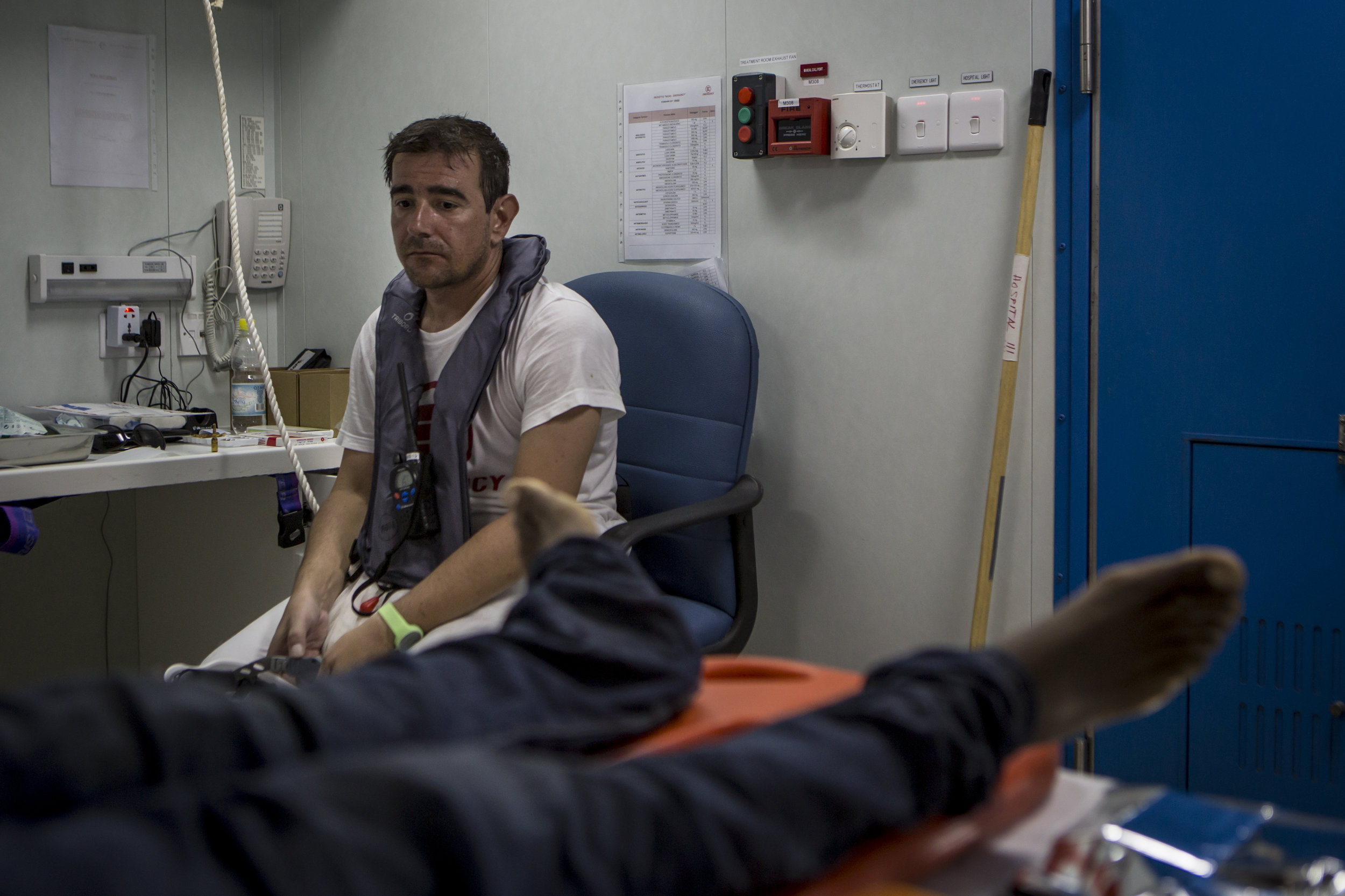  Doctor Alberto, moments after calling the death of an eritrean man. 20 minutes of CPR and multiple shots of adrenaline didn't bring him back. � Mathieu Willcocks/MOAS.eu 2016, all rights reserved. 