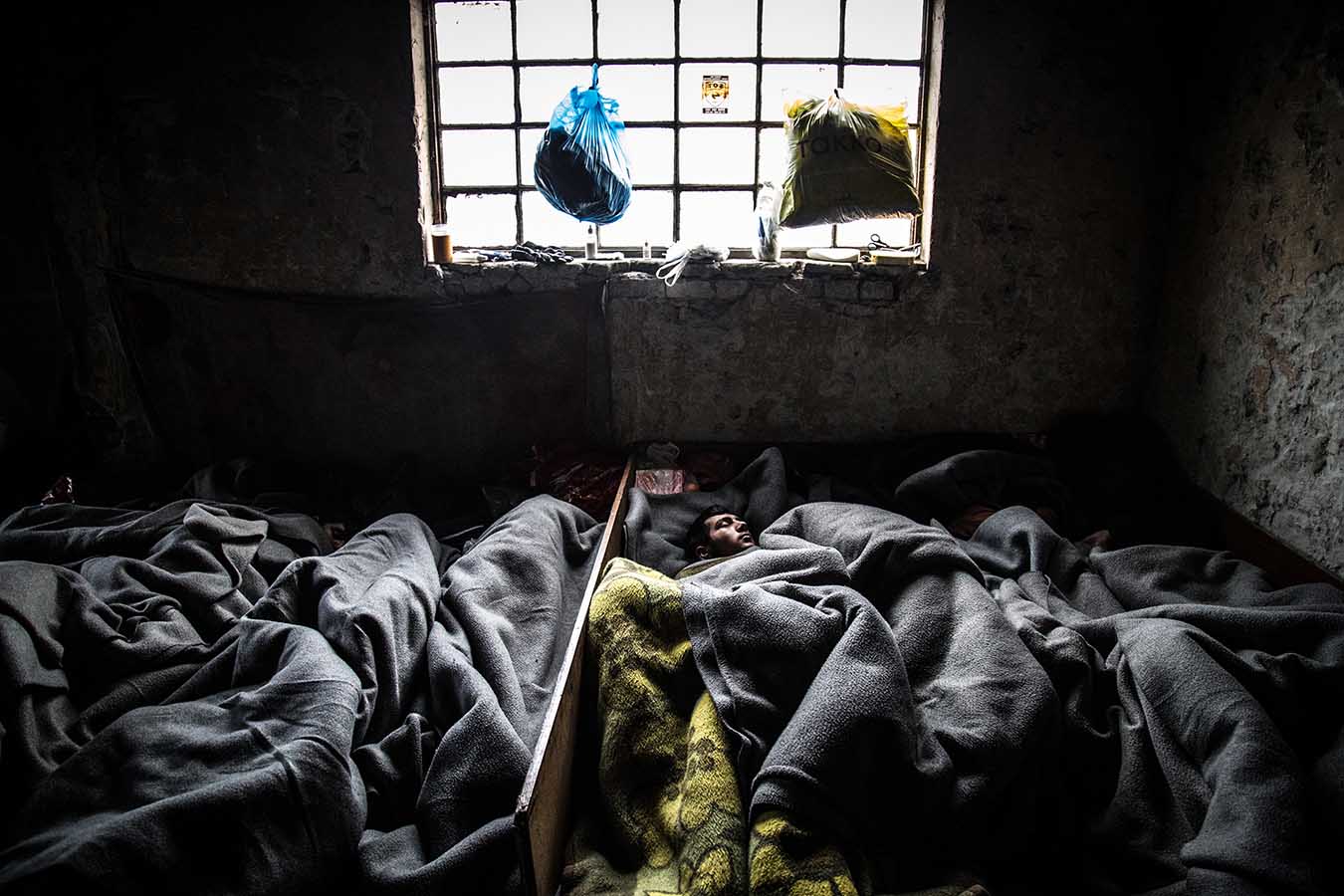  Refugees sleep rough, inside one of the abandoned warehouses in the area of Belgrade's central station, where nearly 1,300 have found refuge from the harsh Serbian winter as they way to cross into Northern and Central Europe.  