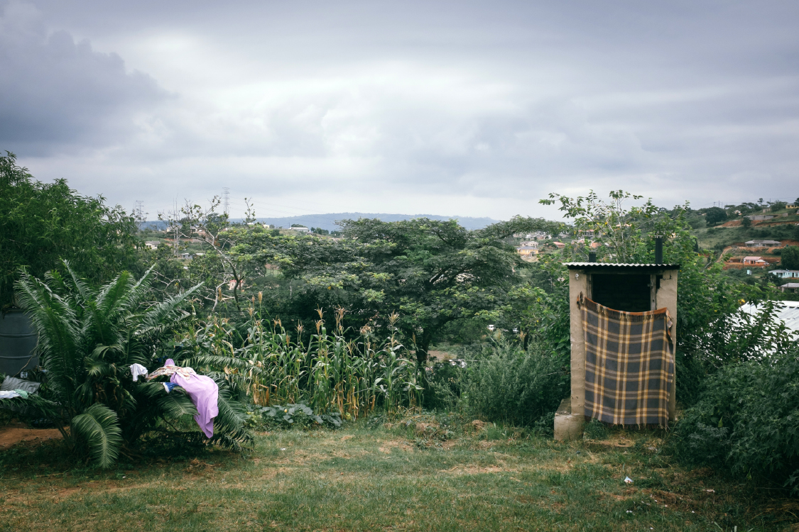  Since 2000, the eThekwini (Durban) Municipality provides basic water and sanitation services in the settlement. This toilet is not being used, because it was built on top of the grave of the resident's husband.   