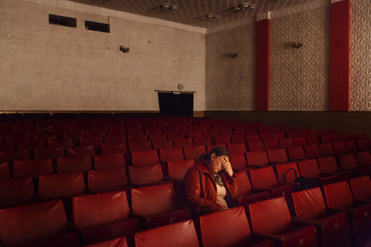  Moldova. Comrat, Gagauzia - November 2017

A tired woman sitting in the cinema of the House of Culture in Comrat, the capital of Gagauzia, while memebers of the staff are setting the projection of the first Gagauz movie in Gagauz language. 