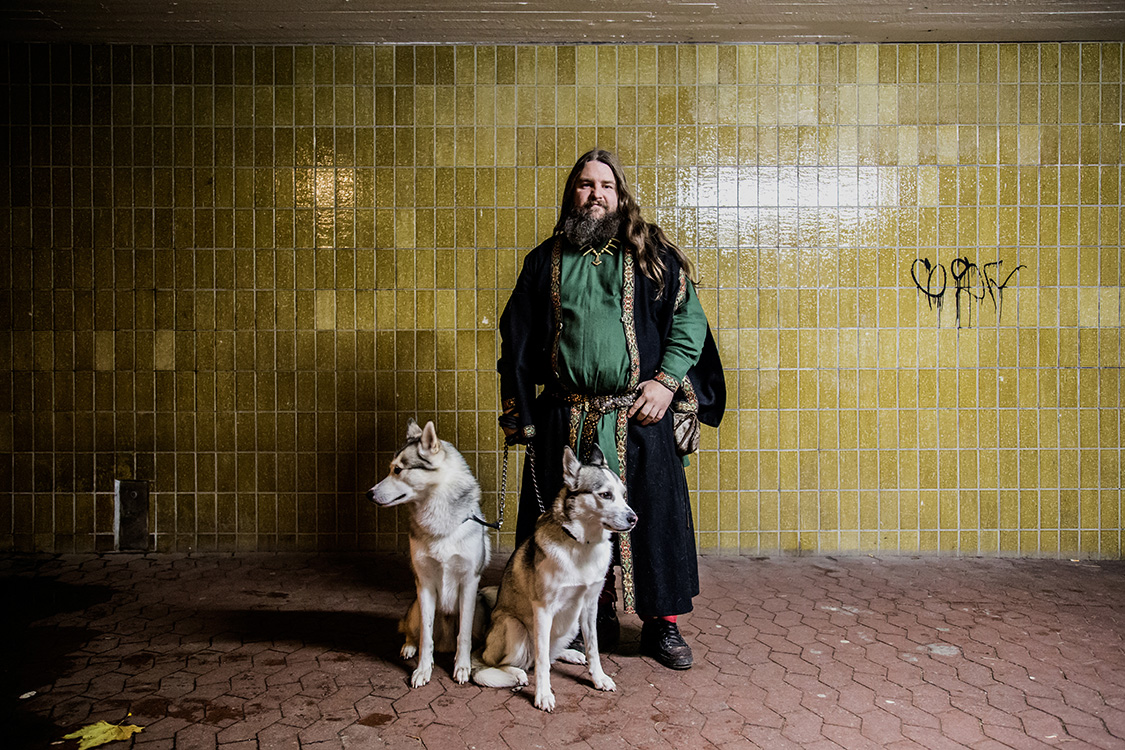  Carl Mikael, an history expert and viking priest, poses for a portrait with his dogs, in a subway in Malmo, Sweden.  