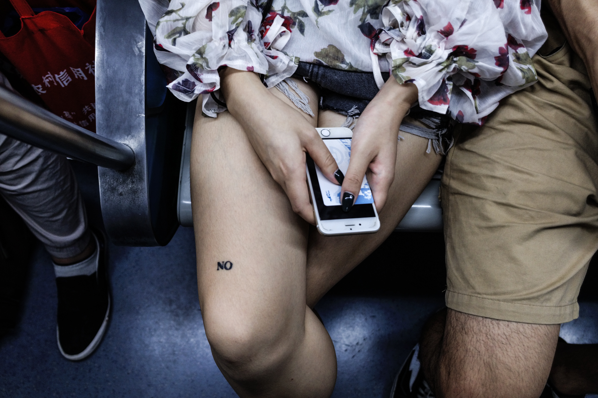  Girl with a NO/ON tattoo on the subway, Beijing, August 2017 