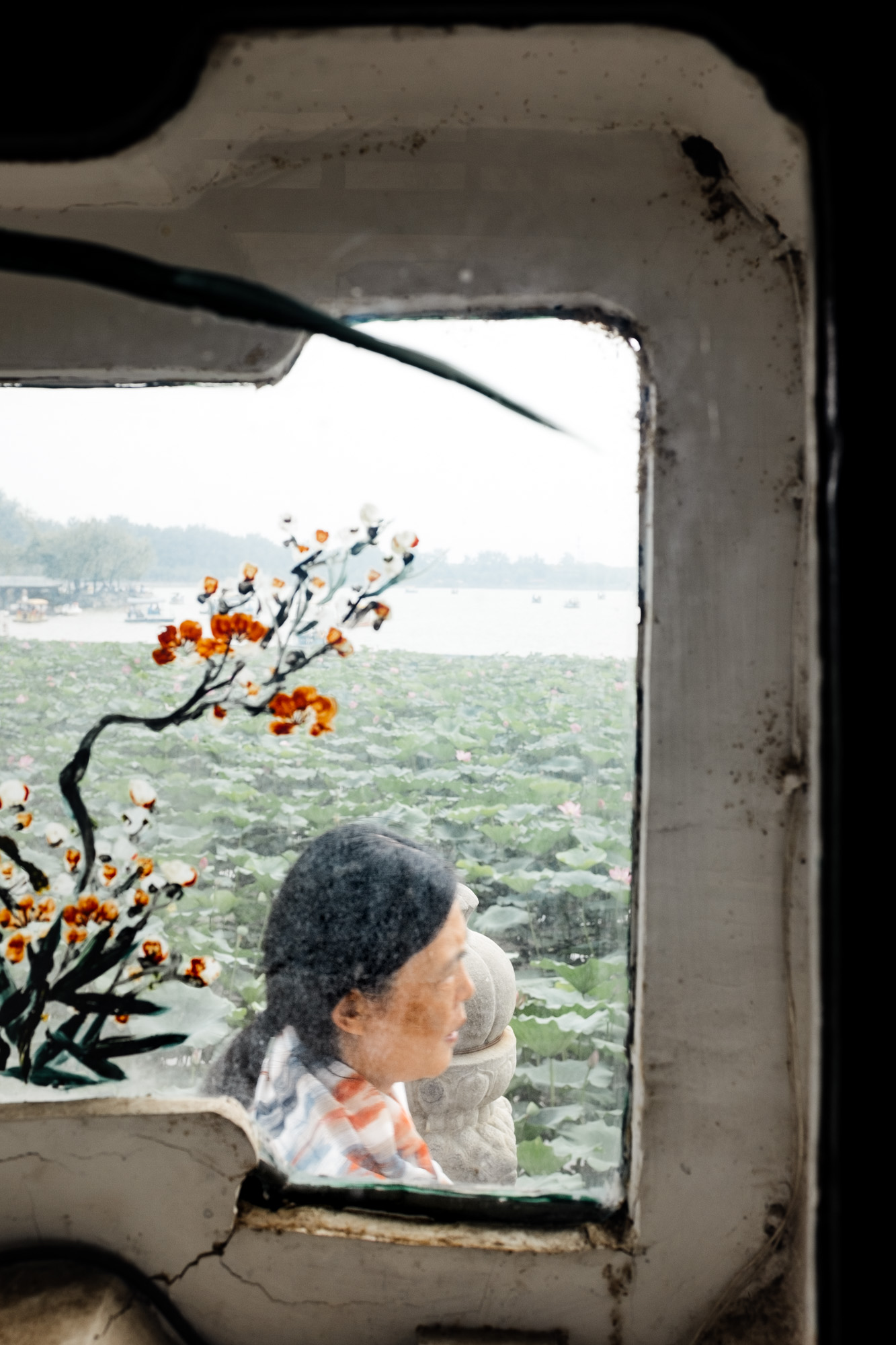  A woman through a window at the Summer Palace, Beijing, August 2017 