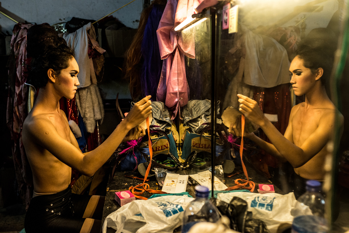  Dimas, a young waria performer, 17, is getting ready for her show, in the dressing room of Moonlight discoteque. Jakarta, Indonesia, 21st April, 2015. 