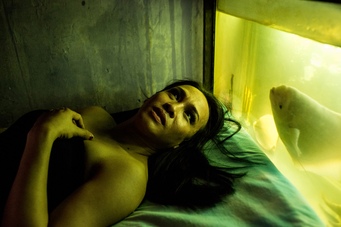  Ririn, 35, is a waria from Bengkulu province (Sumatra). She couldn't finish her studies because her family cannot afford it so she moved to Jakarta, where she lives, together with a pet fish, in a tiny rental room at the first floor of a crowded, ra