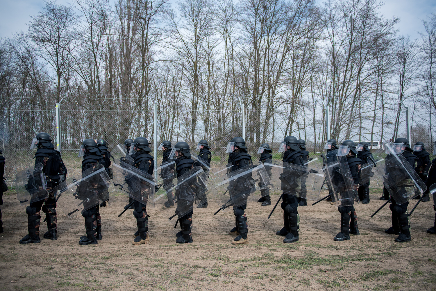  Riot soldiers stand in front of a practice fence at a military practice  near Kelebia, Hungary 22 March 2018. The fence was constructed in the middle of the European migration crisis in 2015, with the aim to ensure border security by preventing immi