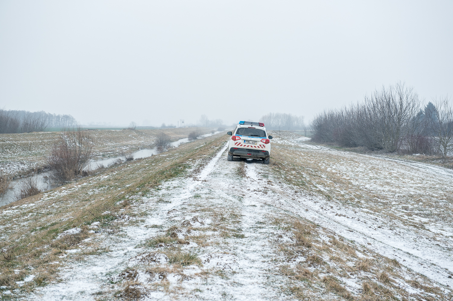  Police car stands on a dam near Illocska, Hungary 26 February 2018. The fence was constructed in the middle of the European migration crisis in 2015, with the aim to ensure border security by preventing immigrants from entering the country and the E